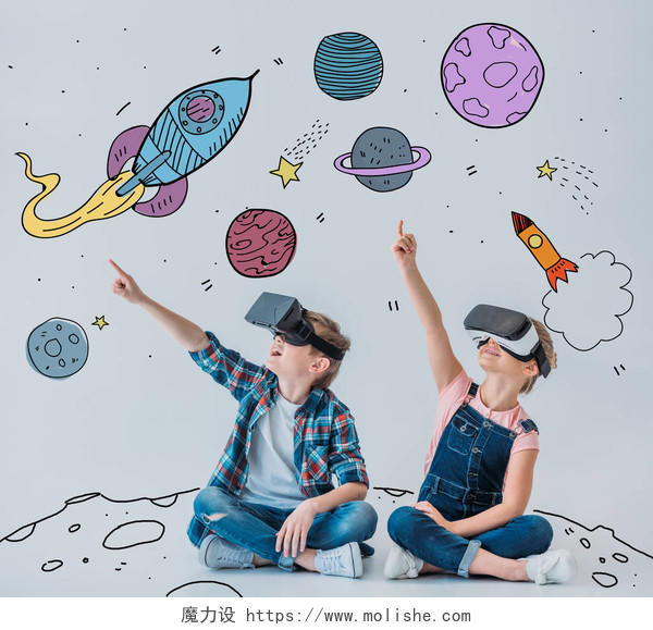 休闲儿童使用虚拟现实耳机而坐在地板上涂鸦空间墙上图片